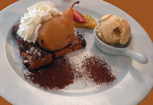Poached pear with gingerbread and salted caramel ice cream.