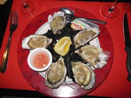 photo of 6 oysters on the half-shell