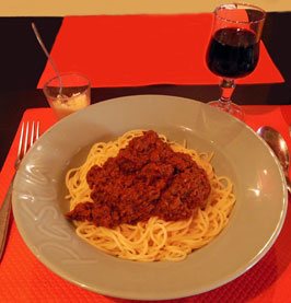 photo of spaghetti bolognaise with parmesan cheese to sprinkle